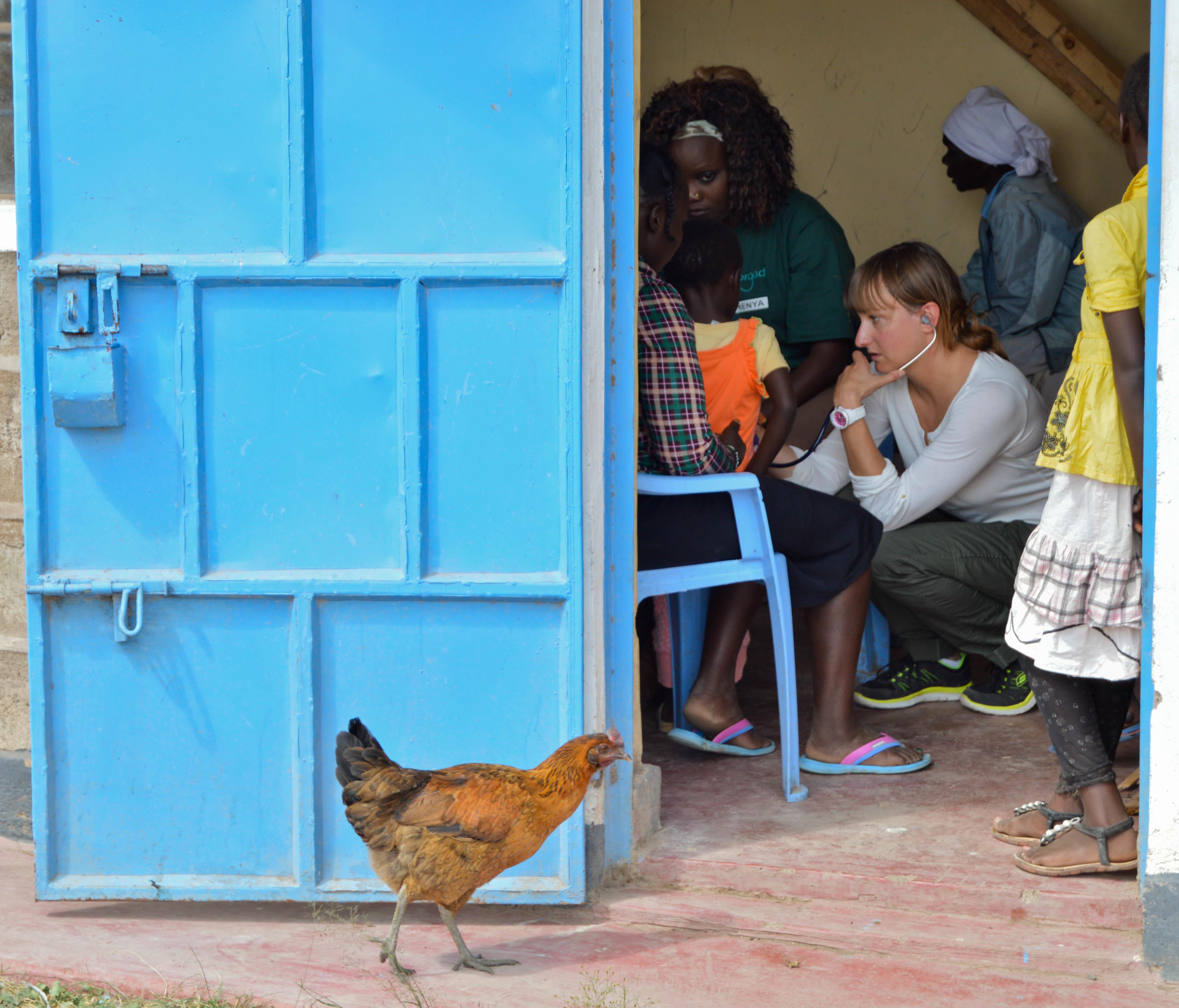 A German Projects Abroad medical intern listens to a patient's heartbeat at a medical outreach during her nursing internship in Kenya. Projects Abroad, German intern listens to a patients heartbeat at a medical outreach centre during her nursing internship in Kenya.